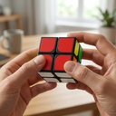 AI-generated illustrative scene — adult using one 2×2 puzzle cube (not a customer photo)